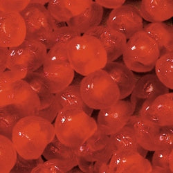 Photo of glace whole red cherries. These cherries are more vibrant and juicy-looking than dried cherries that have not undergone the glace process.