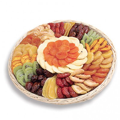 Photo of holiday sampler showing assorted dried fruits arranged in a round basket