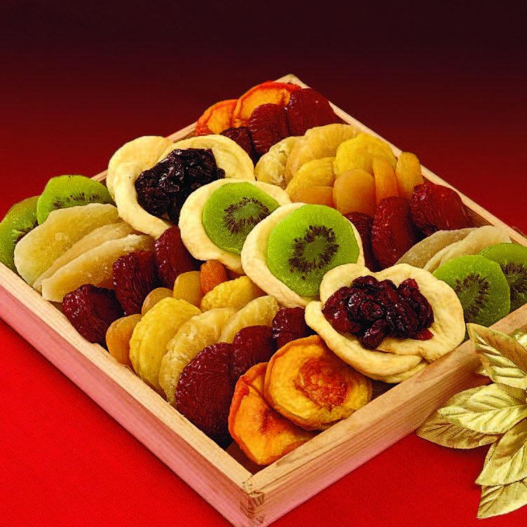 Photo of the exotic fruit tray, a square wooden tray containing dried fruit arranged in colorful stripes.
